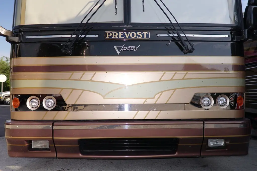 Prevost H3-45 Vantare Featherlite after a headlight upgrade by Excalibur Coach
